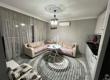 Недорогая вторичная недвижимость: квартира 1+1, 60м², с ремонтом и новой мебелью в 200м от моря в Махмутларе, Алания ID-18488 фото-2