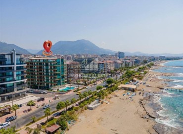 Видовая стильная квартира 1+1, 65м², в элитном комплексе на первой береговой линии в районе Тосмур, Алания ID-18497 фото-1