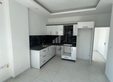 Новые апартаменты с одной спальней, 50м², в комплексе с бассейном в районе Махмутлар, Алания, по привлекательной цене ID-18507 фото-2