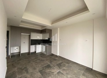 Апартаменты 1+1, 55м², с чистовой отделкой в резиденции премиум класса в Махмутларе, Алания ID-18510 фото-3