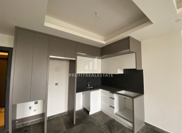 Апартаменты 1+1, 55м², с чистовой отделкой в резиденции премиум класса в Махмутларе, Алания ID-18510 фото-4