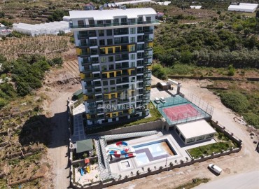 Двухкомнатная меблированная квартира, 50м², с видом на горы в комплексе с отельной инфраструктурой в Махмутларе, Алания ID-18512 фото-2