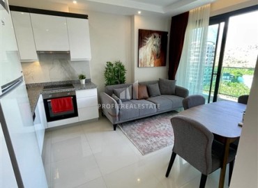 Двухкомнатная меблированная квартира, 50м², с видом на горы в комплексе с отельной инфраструктурой в Махмутларе, Алания ID-18512 фото-3