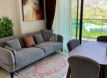 Двухкомнатная меблированная квартира, 50м², с видом на горы в комплексе с отельной инфраструктурой в Махмутларе, Алания ID-18512 фото-4