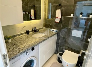 Двухкомнатная меблированная квартира, 50м², с видом на горы в комплексе с отельной инфраструктурой в Махмутларе, Алания ID-18512 фото-9