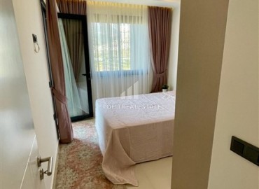 Двухкомнатная меблированная квартира, 50м², с видом на горы в комплексе с отельной инфраструктурой в Махмутларе, Алания ID-18512 фото-11