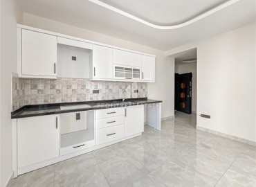 Новая квартира с одной спальней, 68м², в новом комплексе с инфраструктурой, в 400м от моря в Махмутларе, Алания ID-18514 фото-1