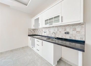 Новая квартира с одной спальней, 68м², в новом комплексе с инфраструктурой, в 400м от моря в Махмутларе, Алания ID-18514 фото-2