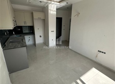 Апартаменты 1+1, 49м², в комплексе премиум класса на окончательном этапе строительства в центре Махмутлара, Алания ID-17346 фото-2