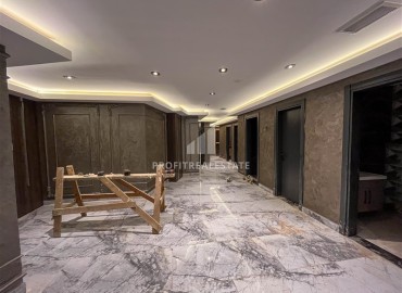 Апартаменты 1+1, 49м², в комплексе премиум класса на окончательном этапе строительства в центре Махмутлара, Алания ID-17346 фото-16