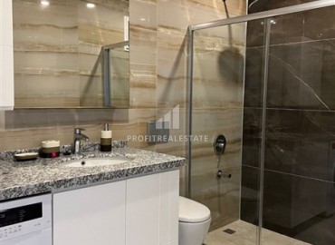 Элитная квартира с одной спальней, 60м², в фешенебельной резиденции с собственным пляжем в районе Каргыджак, Алания ID-18540 фото-4