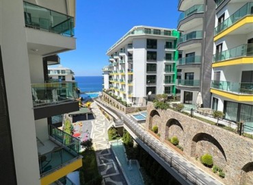 Элитная квартира с одной спальней, 60м², в фешенебельной резиденции с собственным пляжем в районе Каргыджак, Алания ID-18540 фото-10