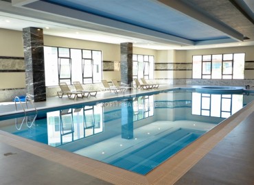 Элитная квартира с одной спальней, 60м², в фешенебельной резиденции с собственным пляжем в районе Каргыджак, Алания ID-18540 фото-11