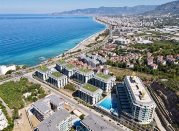 Элитная квартира с одной спальней, 60м², в фешенебельной резиденции с собственным пляжем в районе Каргыджак, Алания ID-18540 фото-17