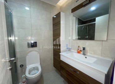 Меблированные апартаменты 1+1, 68м², на высоком этаже в элитном комплексе в 500м от моря в Махмутларе, Алания ID-18561 фото-11