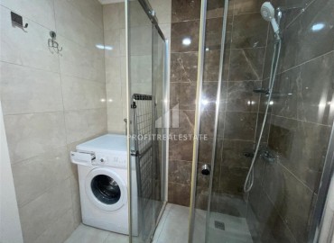 Меблированные апартаменты 1+1, 68м², на высоком этаже в элитном комплексе в 500м от моря в Махмутларе, Алания ID-18561 фото-12