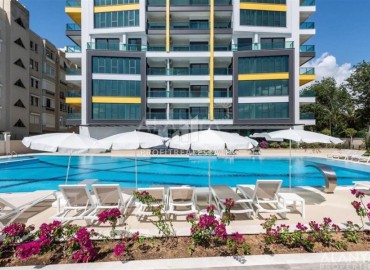 Стильная двухкомнатная квартира, 65м², в фешенебельном комплексе на первой береговой линии в Махмутларе, Алания. ID-18570 фото-1