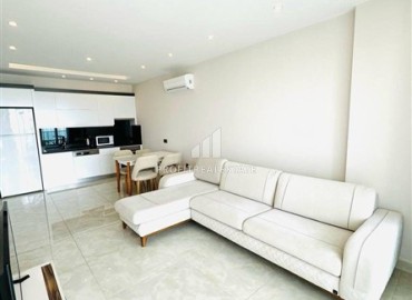 Стильная двухкомнатная квартира, 65м², в фешенебельном комплексе на первой береговой линии в Махмутларе, Алания. ID-18570 фото-2