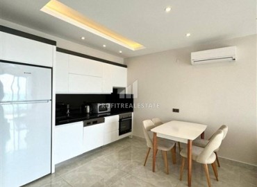 Стильная двухкомнатная квартира, 65м², в фешенебельном комплексе на первой береговой линии в Махмутларе, Алания. ID-18570 фото-5