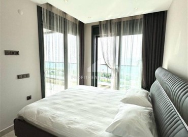 Стильная двухкомнатная квартира, 65м², в фешенебельном комплексе на первой береговой линии в Махмутларе, Алания. ID-18570 фото-9