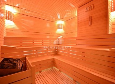 Стильная двухкомнатная квартира, 65м², в фешенебельном комплексе на первой береговой линии в Махмутларе, Алания. ID-18570 фото-13