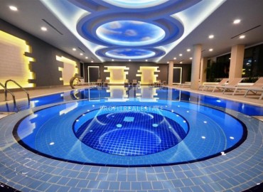 Стильная двухкомнатная квартира, 65м², в фешенебельном комплексе на первой береговой линии в Махмутларе, Алания. ID-18570 фото-15