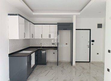 Квартира с одной спальней, 50м², в новом комплексе с бассейном в центре Махмутлара, Алания, по выгодной цене ID-18571 фото-2