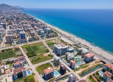 Фешенебельная двухкомнатная квартира, 57м², в элитном проекте на 1-й береговой линии в районе Кестель, Алания на этапе строительства ID-18576 фото-2