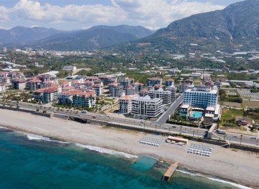 Фешенебельная двухкомнатная квартира, 57м², в элитном проекте на 1-й береговой линии в районе Кестель, Алания на этапе строительства ID-18576 фото-3