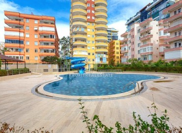 Уютная квартира с двумя спальнями, 105м², в районе рынка по вторникам в Махмутларе, Алания, в комплексе с бассейном ID-18599 фото-1