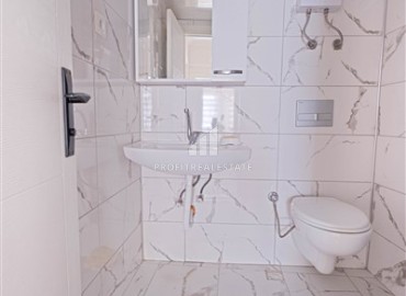 Недорогая недвижимость в Махмутларе, Алания: трехкомнатная квартира, 100м², на центральной улице в 200м от моря ID-18621 фото-10