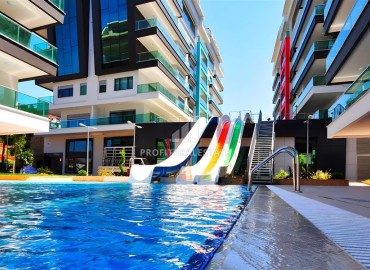 Меблированные апартаменты 1+1, 65м², в элитном комплексе с собственным пляжем в Каргыджаке, Алания ID-18625 фото-10