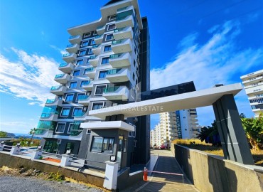 Элегантная квартира с одной спальней, 50м², в новом комфортабельном комплексе в районе Махмутлар, Алания ID-18639 фото-1