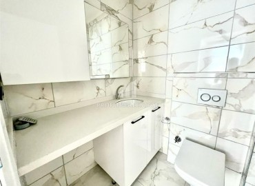 Элегантная квартира с одной спальней, 50м², в новом комфортабельном комплексе в районе Махмутлар, Алания ID-18639 фото-10