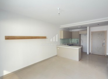 Выгодное предложение в Мерсине: новая двухкомнатная квартира, 70м², с выходом в сад в Тедже, недалеко от моря ID-18653 фото-2