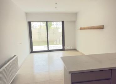 Выгодное предложение в Мерсине: новая двухкомнатная квартира, 70м², с выходом в сад в Тедже, недалеко от моря ID-18653 фото-6