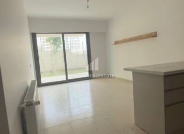 Выгодное предложение в Мерсине: новая двухкомнатная квартира, 70м², с выходом в сад в Тедже, недалеко от моря ID-18653 фото-7