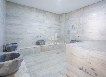 Комфортабельные двухкомнатные апартаменты, 65м², с остекленным балконом в 350м от моря в Махмутларе, Алания ID-18657 фото-16