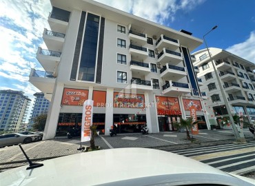 Двухкомнатная квартира с дизайнерским интерьером, 50м², в новостройке с бассейном в районе Махмутлар, Алания ID-18658 фото-1