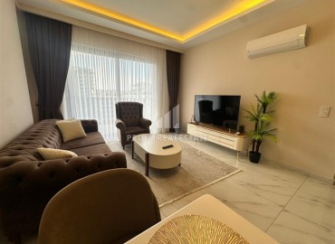 Двухкомнатная квартира с дизайнерским интерьером, 50м², в новостройке с бассейном в районе Махмутлар, Алания ID-18658 фото-4