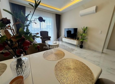 Двухкомнатная квартира с дизайнерским интерьером, 50м², в новостройке с бассейном в районе Махмутлар, Алания ID-18658 фото-6