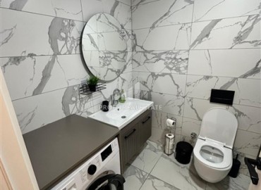 Двухкомнатная квартира с дизайнерским интерьером, 50м², в новостройке с бассейном в районе Махмутлар, Алания ID-18658 фото-8