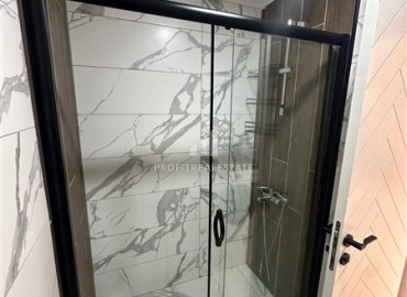 Двухкомнатная квартира с дизайнерским интерьером, 50м², в новостройке с бассейном в районе Махмутлар, Алания ID-18658 фото-9