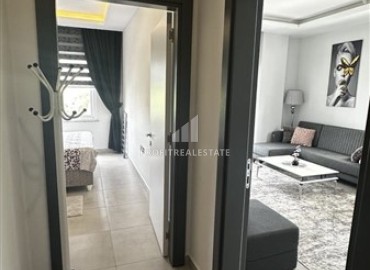 Уютные апартаменты 1+1, 55м², в комплексе с хорошей инфраструктурой, недалеко от моря в Махмутларе, Алания ID-18659 фото-10