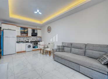 Квартира с одной спальней, 55м², с лаконичным интерьером в новой резиденции с бассейном в Махмутларе, Алания ID-18660 фото-3