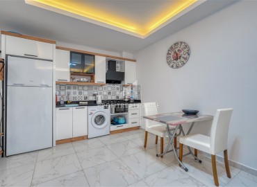 Квартира с одной спальней, 55м², с лаконичным интерьером в новой резиденции с бассейном в Махмутларе, Алания ID-18660 фото-4