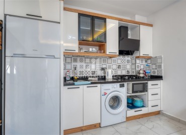 Квартира с одной спальней, 55м², с лаконичным интерьером в новой резиденции с бассейном в Махмутларе, Алания ID-18660 фото-6