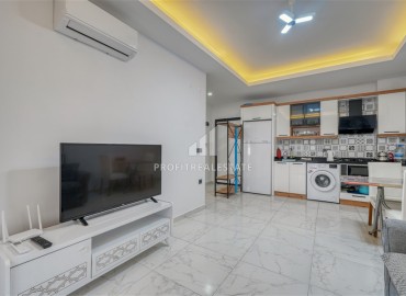 Квартира с одной спальней, 55м², с лаконичным интерьером в новой резиденции с бассейном в Махмутларе, Алания ID-18660 фото-7