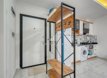 Квартира с одной спальней, 55м², с лаконичным интерьером в новой резиденции с бассейном в Махмутларе, Алания ID-18660 фото-8