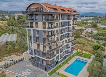 Элегантные двухкомнатные апартаменты, 50м², в новом комфортабельном комплексе в Авсалларе, Алания ID-18666 фото-1